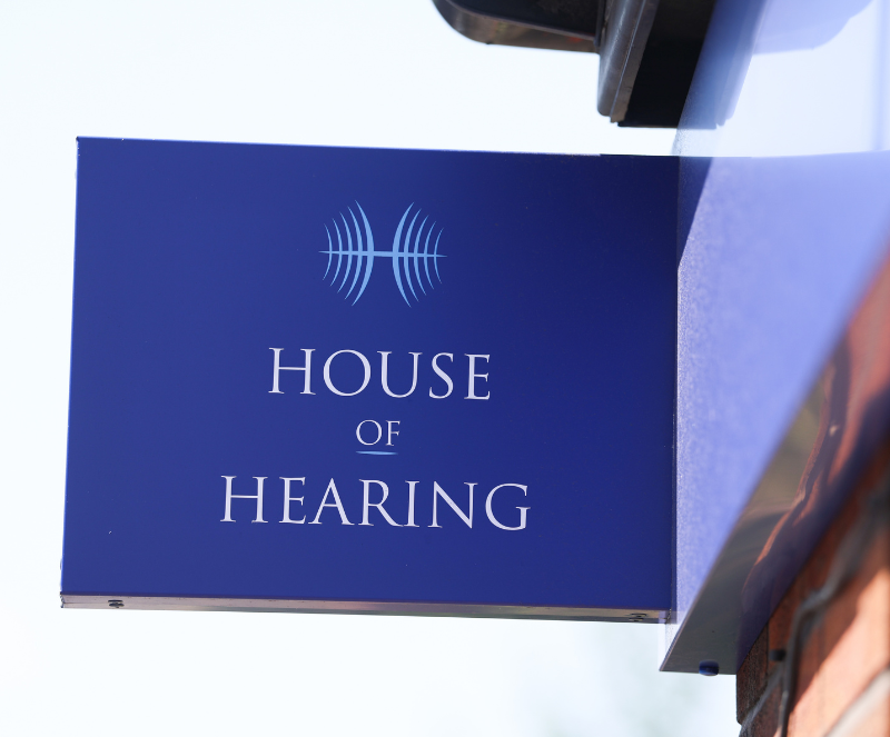 Projecting branded sign at House of Hearing Ashton-under-Lyne.
