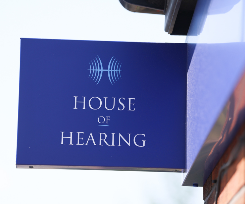 Projecting branded sign at House of Hearing Ashton-under-Lyne.