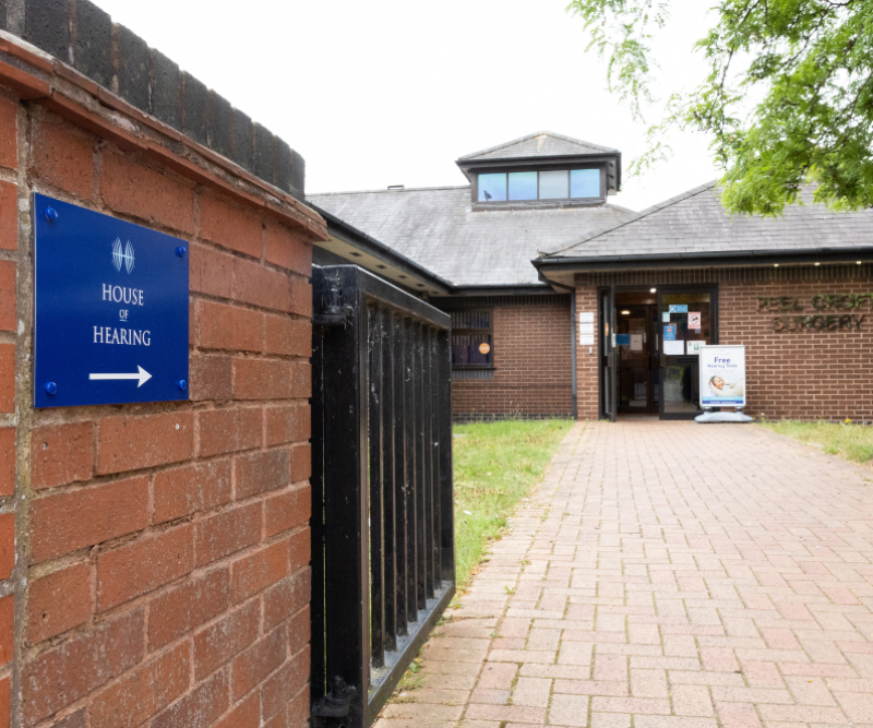 Directional signage outside House of Hearing Burton upon Trent.