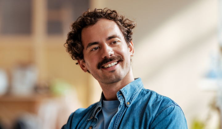 News Young man wearing hearing aids